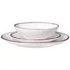 A white ceramic dinnerware set with a brown rim, stacked on a white background. Náhled obrázku produktu
