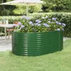A green raised garden bed filled with purple hydrangeas sits on a lawn in a garden setting, with a table and umbrella visible in the background. Anteprima dell’immagine prodotto