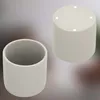 Two cylindrical pots are shown against a blurred background. One pot is viewed from the side, and the other is viewed from the top. Náhled obrázku produktu