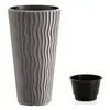 A tall, textured gray planter and a small black insert pot are shown against a white background. Voir les images du produit