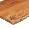 A close-up view of a wooden tabletop with a live edge. Produktbild-Vorschau