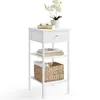 A white bedside table with a drawer and two shelves, displayed on a white background. Náhled obrázku produktu