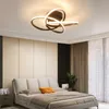 A modern bedroom with a bed and a ceiling light. Produktbild-Vorschau