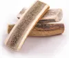 Three pieces of deer antler dog chews are stacked on a white background. Anteprima dell’immagine prodotto