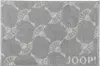 A close-up, top-down view of a bath mat with a repeating pattern and the brand name visible. Produktbild-Vorschau