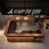 A modern bar counter in a cafe or restaurant setting, with baked goods displayed on shelves above. Voir les images du produit