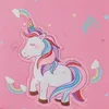 A close-up of a pink fabric with a cartoon unicorn and rainbows printed on it. Anteprima dell’immagine prodotto