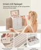 A woman is shown interacting with a white jewelry box, with close-up shots of its features. Produktbild-Vorschau