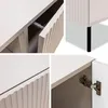 A collage of four close-up images showing details of a white TV-lowboard. Náhled obrázku produktu