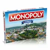 A Monopoly board game box featuring a cityscape. Produktbild-Vorschau