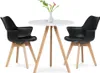 A modern dining set with two black chairs and a white table, decorated with a vase of flowers. Produktbild-Vorschau