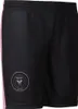A pair of black soccer shorts with a pink stripe on the side and a circular team logo on the left leg. Produktbild-Vorschau