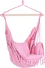 A pink hammock chair hanging from a wooden bar. Podgląd zdjęcia produktu
