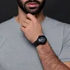 A close-up shot of a man's wrist wearing a black Casio G-Shock watch. Produktbild-Vorschau