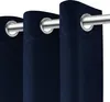Close-up view of navy blue curtains with grommets on a silver curtain rod. Podgląd zdjęcia produktu