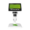 A digital microscope with an LCD screen displaying a magnified leaf, placed on a white stand with a leaf on the base. Produktbild-Vorschau