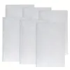 A stack of white vacuum cleaner bags. Voir les images du produit