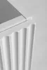 A close-up of a white cabinet with fluted detailing. Náhled obrázku produktu
