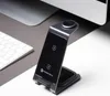 A wireless charging station is placed on a desk next to a keyboard and a computer monitor. Produktbild-Vorschau
