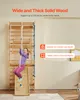 A young girl is climbing a wooden indoor gym set. Anteprima dell’immagine prodotto
