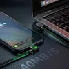 A smartphone and a laptop are connected by a USB-C cable, indicating data transfer or charging. Anteprima dell’immagine prodotto