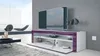 A modern living room with a TV stand, TV, and decorative items. Produktbild-Vorschau