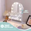 A vanity mirror with lights is displayed on a desk, surrounded by makeup and decorative items. Produktbild-Vorschau