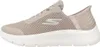 Side view of a beige Skechers women's slip-on shoe with a white sole. Anteprima dell’immagine prodotto