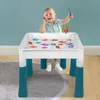A young boy playing with a fishing toy at a table. Produktbild-Vorschau