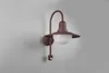 A brown outdoor wall lamp with a motion sensor is mounted on a light gray wall. Produktbild-Vorschau