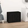 A black wooden laundry chest is placed in a laundry room next to a washing machine. Anteprima dell’immagine prodotto