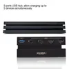 A black USB hub is shown connected to a black PS4 console, with text describing its features. Náhled obrázku produktu