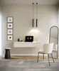 A modern home office setup with a floating desk, laptop, chair, and mirror. Produktbild-Vorschau