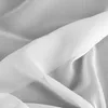 A close-up shot of white fabric draped and folded. Produktbild-Vorschau