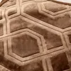 A close-up view of a textured brown fabric with a geometric pattern. Podgląd zdjęcia produktu