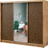 A bedroom scene featuring a wardrobe with sliding doors and a mirror, reflecting a room with furniture and plants. Produktbild-Vorschau
