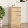 A modern chest of drawers in a room with a potted plant. Anteprima dell’immagine prodotto