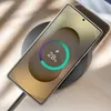 A smartphone is wirelessly charging on a charging pad, displaying a charging percentage. Anteprima dell’immagine prodotto