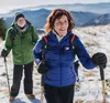 Two people hiking in a snowy mountain landscape. Produktbild-Vorschau