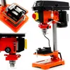 A collage of images showing different views and details of a drill press machine, including a close-up of the vice and the drill head. Náhľad obrázku produktu