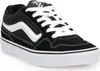 A black and white Vans sneaker is shown against a white background. Voir les images du produit