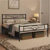 A bedroom scene with a metal bed frame, bedding, and a bedside table with a lamp. Produktbild-Vorschau