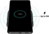 A smartphone is shown on a wireless charging pad, indicating it is fully charged. Produktbild-Vorschau