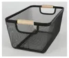 A black wire basket with wooden handles on a light gray background. Produktbild-Vorschau