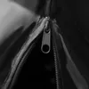 A close-up view of a black zipper on a black fabric bag. Produktbild-Vorschau