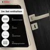 A door handle set with included accessories displayed on a dark wood surface, with a black overlay detailing the contents of the set. Produktbild-Vorschau
