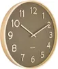 A Karlsson wall clock with a wooden frame and a moss green face. Produktbild-Vorschau