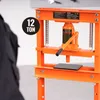 A person is shown from the back, looking at an orange hydraulic press in a workshop or garage setting. Anteprima dell’immagine prodotto