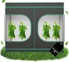A grow tent with plants inside, set on a patch of grass. Voir les images du produit
