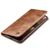A brown leather flip case for a smartphone is shown from a diagonal angle. Produktbild-Vorschau